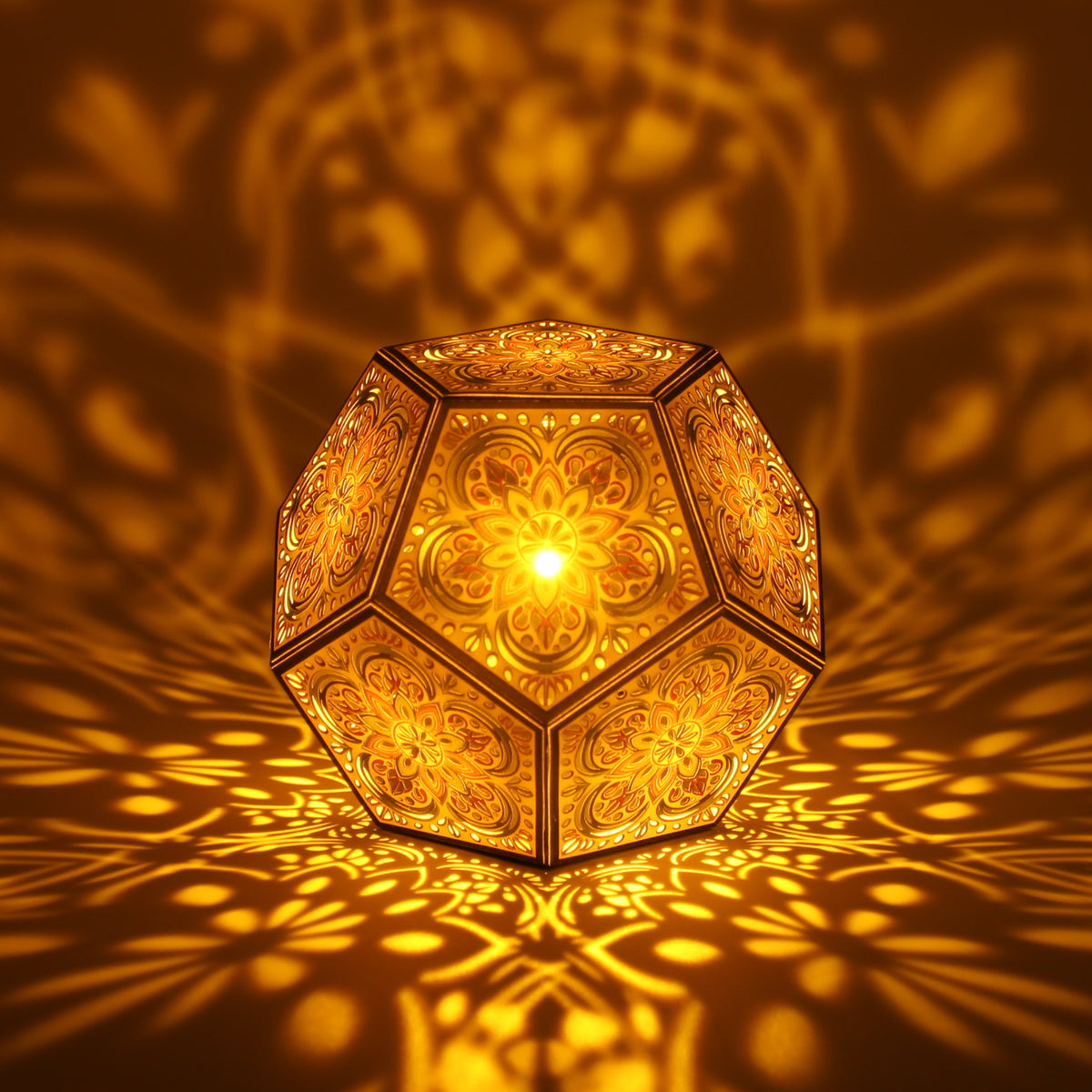 MikhaLuma Agape dodecahedron lantern in Amber style, lit with a warm amber tone