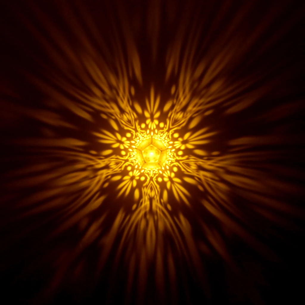 MikhaLuma Agape dodecahedron lantern in Amber style, warm amber light washing a wall