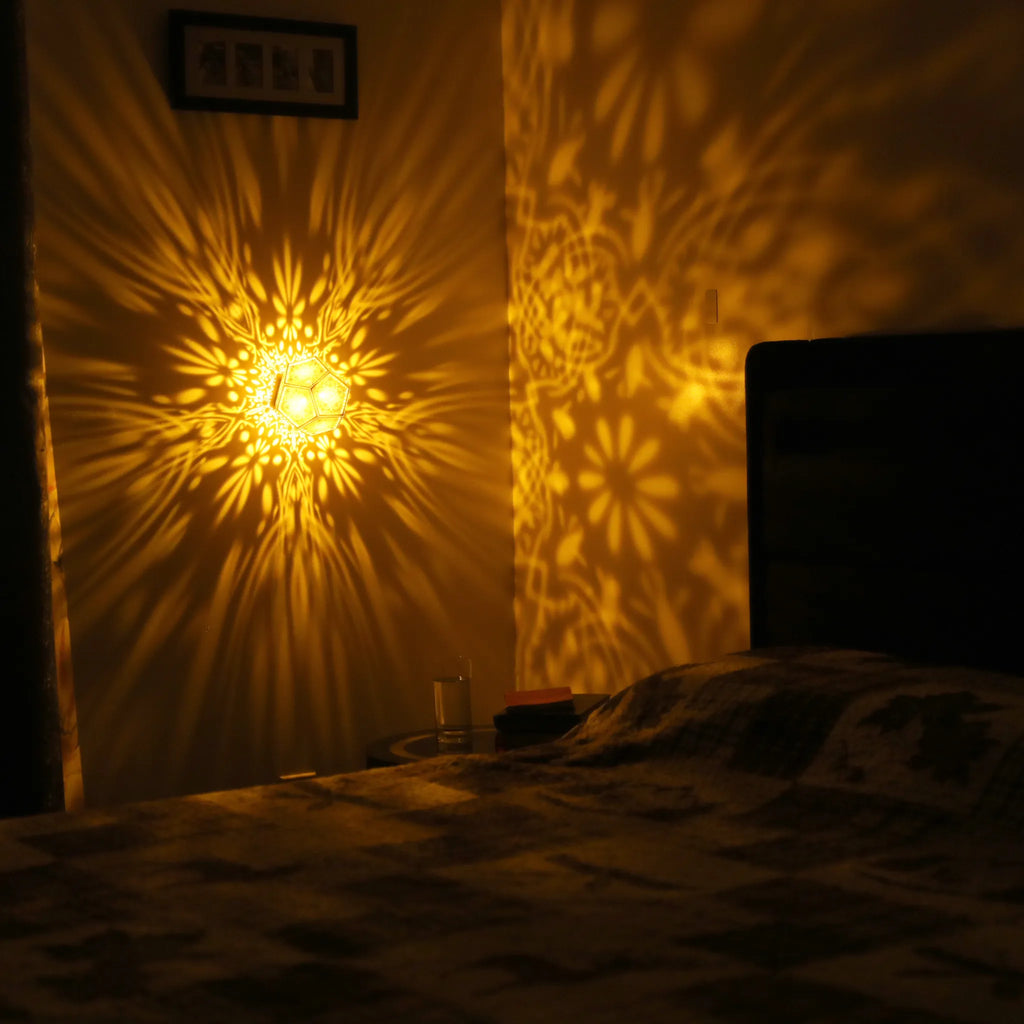 MikhaLuma Agape dodecahedron lantern in Amber style, warm amber light wrapping a wall corner