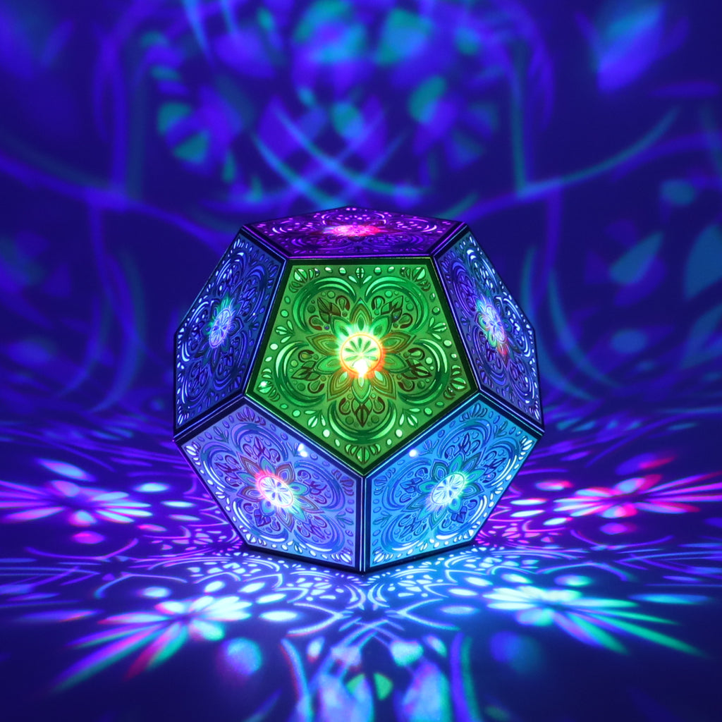 MikhaLuma Agape dodecahedron lantern in Shadow Caster style, casting geometric light patterns across a dark room
